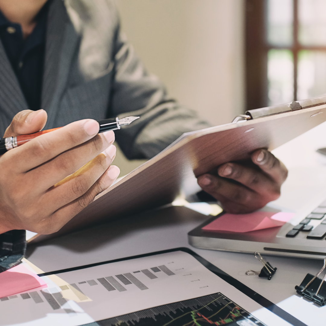 Man looking over checklist on a clipboard